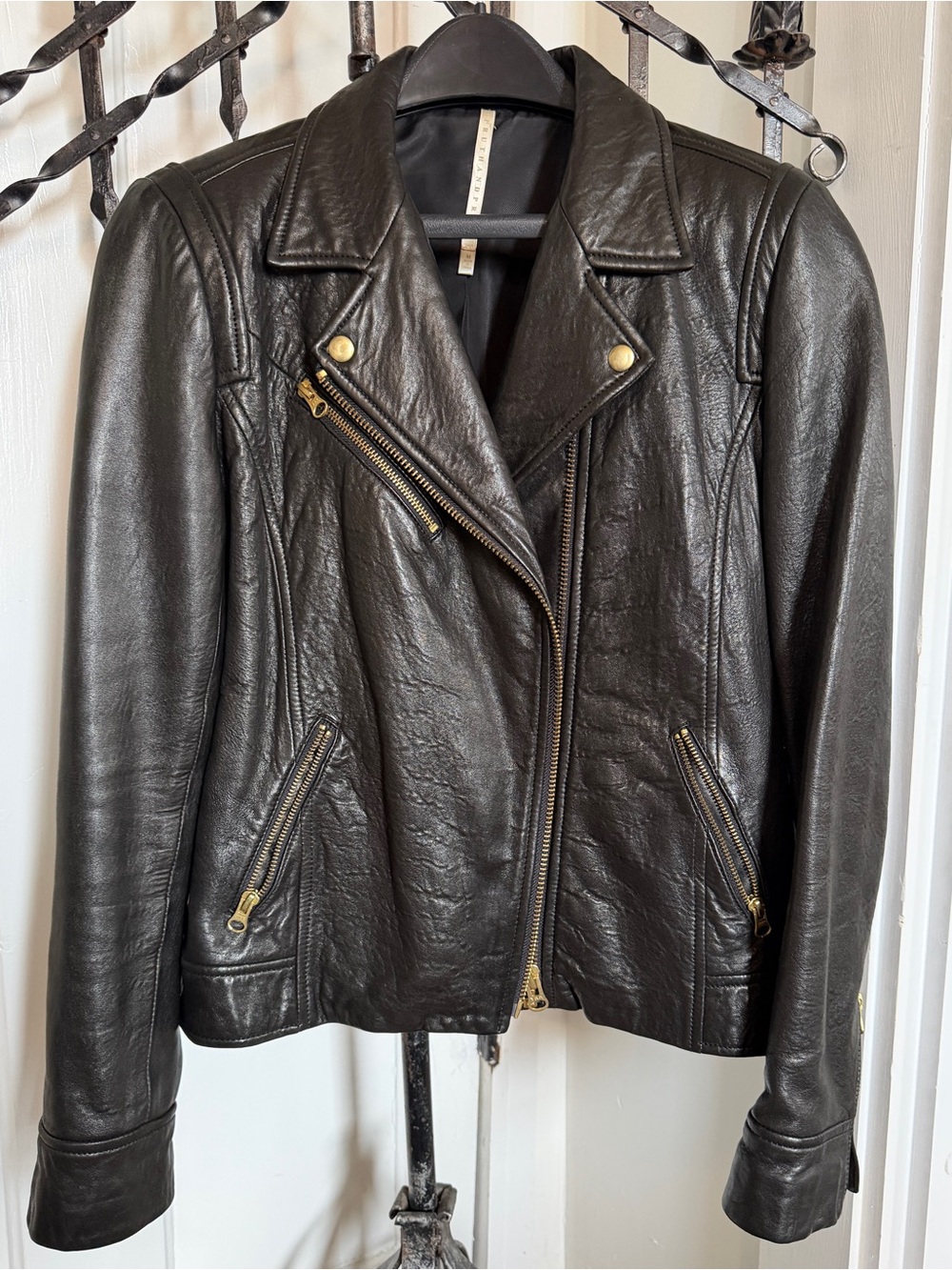 Waist length, lined black leather jacket